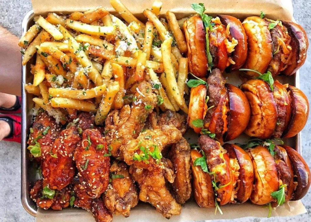 Fried chicken wings, burgers and friesh